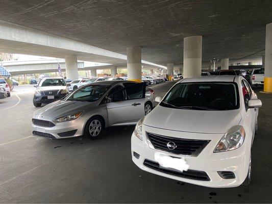 my car (white Nissan) and my brother's (gray Ford)