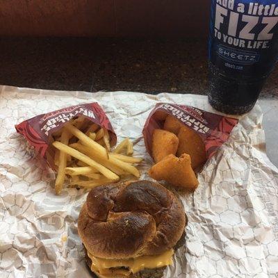 Pretzel bun burger, fries, mac 'n' cheese bites and a Mtn. Dew Pitch Black. Yum!