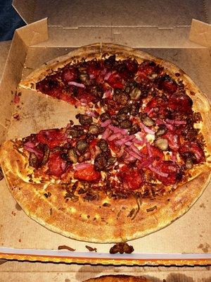 This is the 5 meat treat pizza! All the meat was thrown on the pizza and over cooked on top of it the pizza.