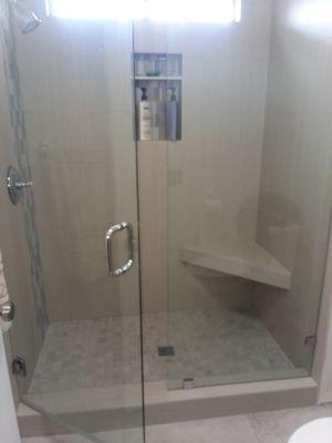 New shower door and glass wall.