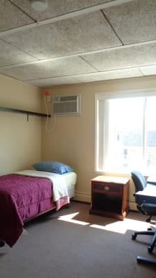 A bedroom in a 2-bedroom apartment.