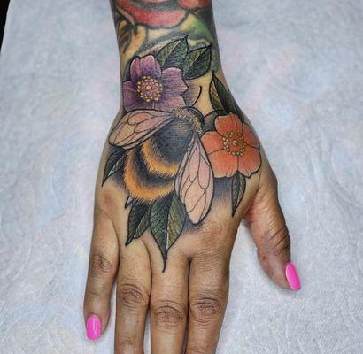 Colorful bee and floral tattoo by @overdedicated