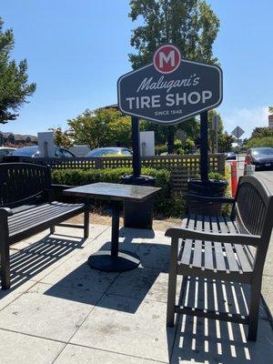 Outdoor open air waiting area at Maluganis Tire in Mill Valley.