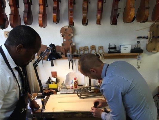 Forming the ribs for a handmade violin.