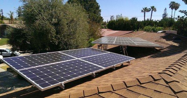 Reverse tilted arrays. The back roof of this home was inclined to the north. The homeowner preferred not to see the panel from the front.