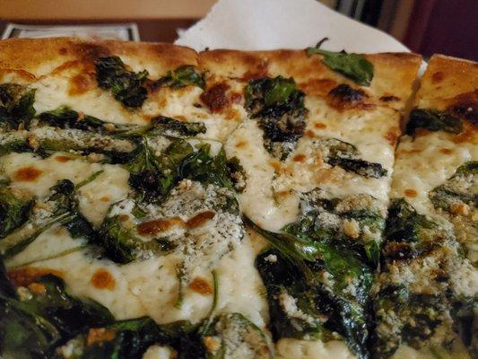 Florentine pollo-less pizza with truffle oil. White pizza with lemon parmesan, garlic and mozzarella spinach. This pizza is life.