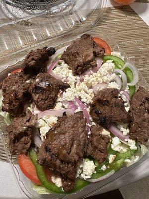 Steak tip salad with feta and onions. $13.99, extra $1 for feta.