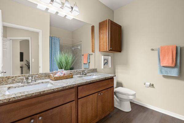 Bathroom with dual vanities at the Villas at Medical Center