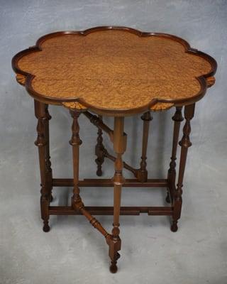 Drop leaf table made of walnut and birds eye maple