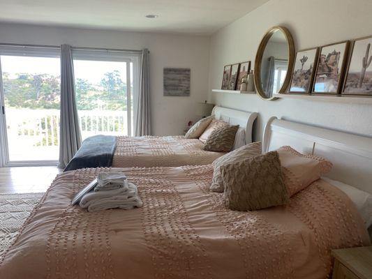 Master Bedroom with a private  balcony view of the Pacific Ocean, Lomas Santa Fe Golf course,  and Del Mar Racetrack.