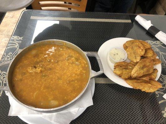 Asopao de gandules with a side of tostones (fried plantains)