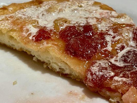 Scone entree accompaniment ($2 upgrade) with generous butter and chunky strawberry jam.