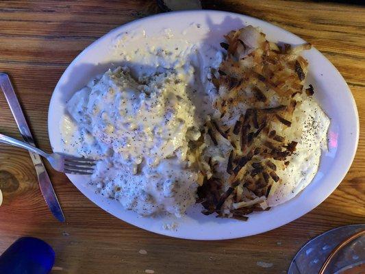 Biscuits and gravy with hash browns and eggs. Everything is homemade and taste great.