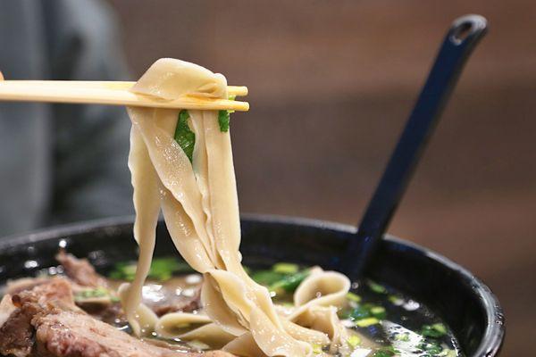 Wide noodles (Signature Beef Bone Noodle Soup)...