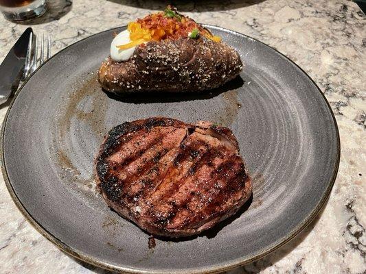 Filet mignon and loaded baked potato