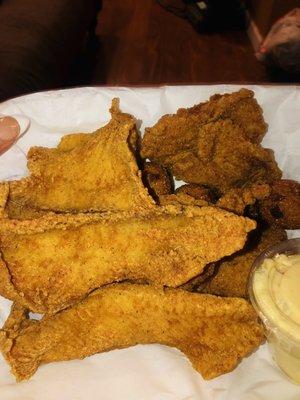 Catfish and Sole dinner with potato salad and hush puppies.