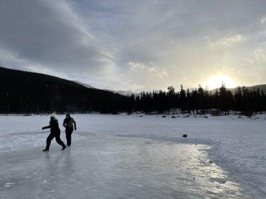 Visitors playing on the frozen lake as the sun sets!