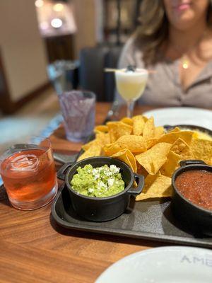 Old Fashioned & Blackberry Sour with Queso, Guac, Salsa & Chips trio.