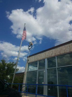 The star  spangled banner flies high carrying the mail near &  far