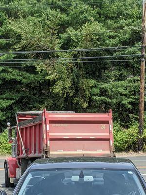 Cherry Hill truck driver #24 giving the middle finger in his driver's mirror after almost causing an accident and verbally attacking me.