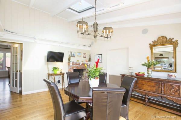 Here is the dinning room, next to the kitchen.  The guest can gather at the dinning table .  the table is a cozy octagonal shape