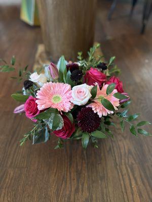 Floral arrangement Gerber daisy, roses, tulips, cremon and mixed greens