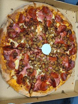 Large meat load pizza.