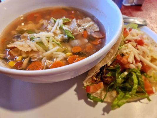 Delicious tortilla soup and taco combo.