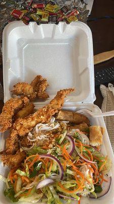 Salad with rice noodles, chicken tenders, and spring roll