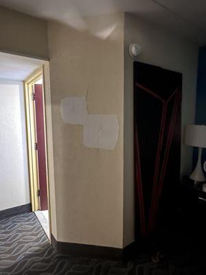 Someone punched through the walls. We saw a couple open doors and this was a pretty consistent situation in the rooms.