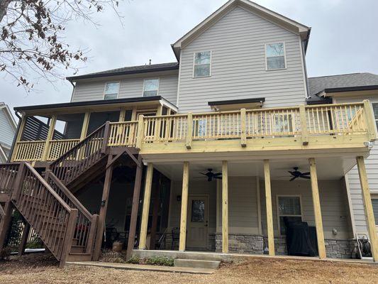 Pressure treated pine deck and screened in porch. New under-decking installed with fans!