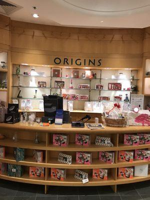 Main counter for Origins skincare and cosmetics.