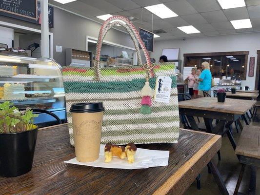 Bag from the shop, SECOND latte and last bit of cruller!