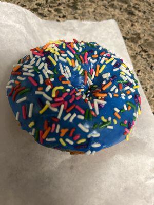 Blue flavor donut for the little one! They have an orange cream frosting and strawberry! Yummm