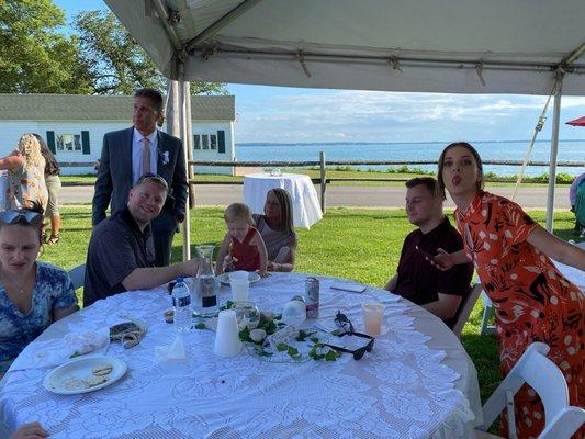 Family enjoying wedding reception with a beautiful backdrop!