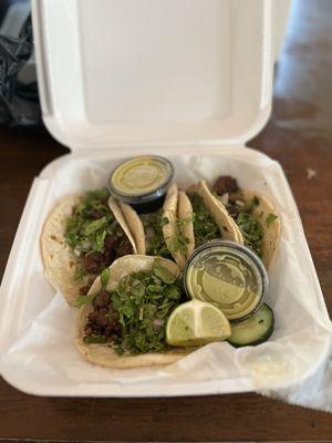 Street tacos with salsa rojo and salsa verdes