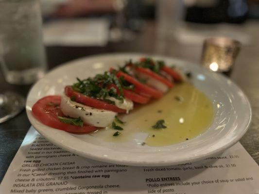 Fresh tomato, mozzarella and basil with olive oil.