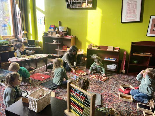 our toddleres working peacefully and independently in the Montessori environment