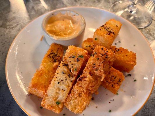 Potato batons with harissa yogurt