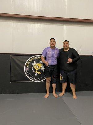 Post training photo with one of Apex Jiu Jitsu's instructors, Isaac.