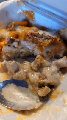 Biscuits and gravy with breakfast sausage and Cholula sauce.