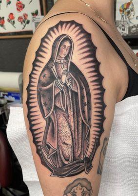 Virgen de Guadalupe done by Niall Keogh, feb '23 (calico critter to the right by Sarah Pham, nov '21)