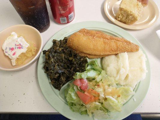 Fried flounder, mashed potatoes, mustard greens, salad, cornbread, and cake.