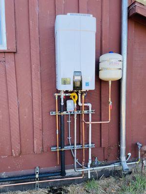 Exterior Navien tankless water heater installed this week in Marin.