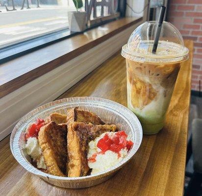 Our iced pistachio latte with french toast, garnished with whipped cream and strawberry puree.