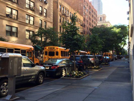 East 88th Street. Glad I don't live at this corner. They are backed up every day idling. 06/27/17