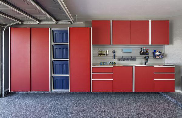 Red Powder Coated Garage Cabinets with Extruded Steel Handles and sliding doors.  Stainless steel workbench and slatwall as well.