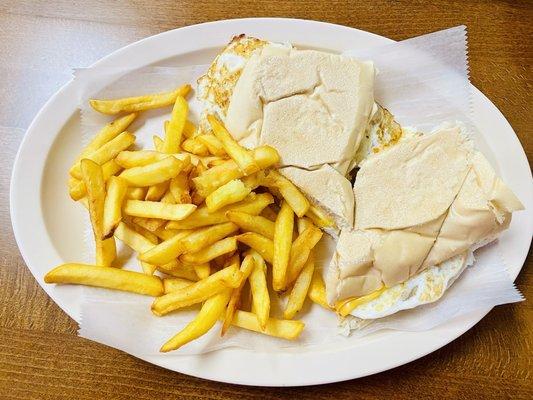 Egg and cheese sandwich with fries