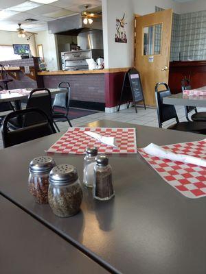 Cute dining area. Can see the large pizza oven from your seats.