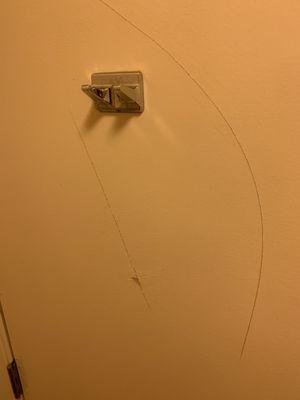 Scratches on the wall.